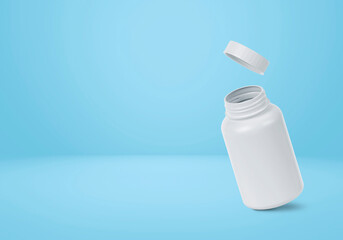 Blank plastic pill bottle on a light blue background