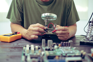 Technicians meticulously repair electronic components to turn them into precious gold. This process...