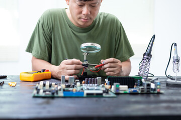 Technicians meticulously repair electronic components to turn them into precious gold. This process...