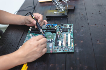 Technicians meticulously repair electronic components to turn them into precious gold. This process...