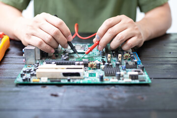 Technicians meticulously repair electronic components to turn them into precious gold. This process...