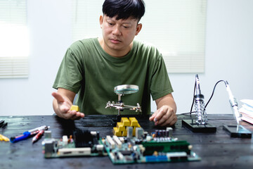 Technicians meticulously repair electronic components to turn them into precious gold. This process...