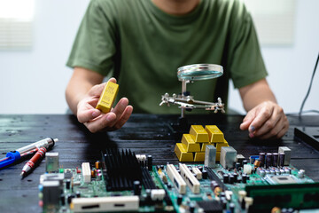 Technicians meticulously repair electronic components to turn them into precious gold. This process...