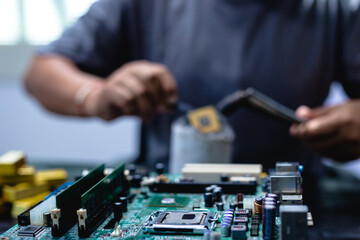 Technicians meticulously repair electronic components to turn them into precious gold. This process...
