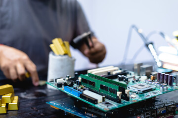 Technicians meticulously repair electronic components to turn them into precious gold. This process...