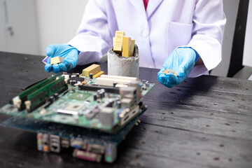Technicians meticulously repair electronic components to turn them into precious gold. This process...