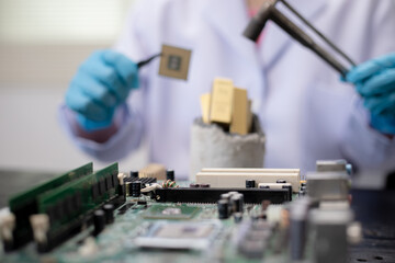Technicians meticulously repair electronic components to turn them into precious gold. This process...