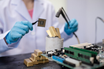 Technicians meticulously repair electronic components to turn them into precious gold. This process...