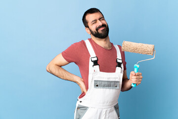 Adult painter man over isolated blue background suffering from backache for having made an effort