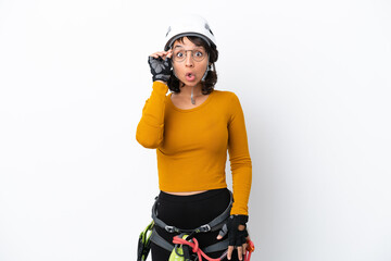 Young woman rock-climber woman isolated on white background with glasses and surprised