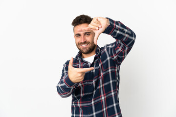 Fototapeta premium Caucasian man isolated on white background focusing face. Framing symbol