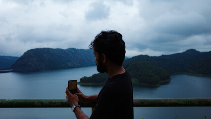 person on the edge of a lake