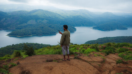 Fototapeta premium person on the top of mountain