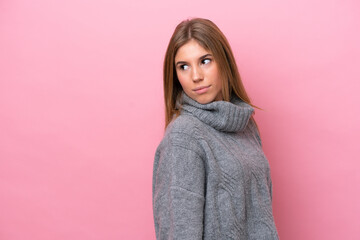 Young caucasian woman isolated on pink bakcground . Portrait