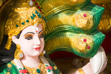 Samut Prakan, Thailand - June, 12, 2024 : Divine Hindu Deity Statue in Thai Temple: A Fusion of Culture and Religion at Samut Prakan, Thailand.