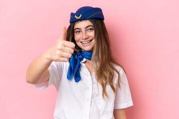 Airplane stewardess caucasian woman isolated on pink background with thumbs up because something good has happened
