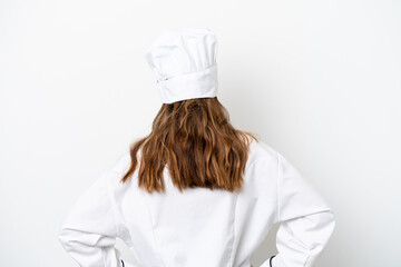 Young caucasian chef woman isolated on white background in back position