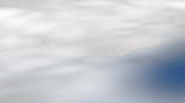 Flying over island through clouds, Madeira island Atlantic ocean, satellite view animation based on imgae by Nasa