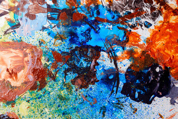 Colorful abstract texture. Smears of oil paint on an art palette. The concept of the modern school of art. Fragment of creative work. Colors of the year 2025