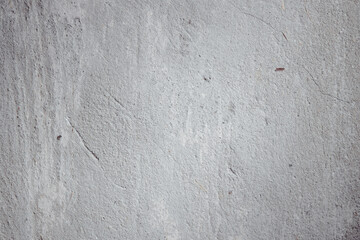 Plastered beige surface with cement material. Textured pattern with space for text. Texture of old gray concrete wall for background. Calm neutral spa background. 