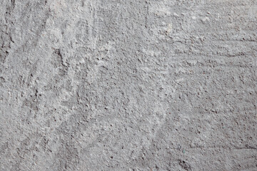 Plastered beige surface with cement material. Textured pattern with space for text. Texture of old gray concrete wall for background. Calm neutral spa background. 