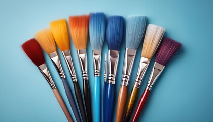 Set of Round Tip Artist Paint Brushes with Wooden Handles on Light Blue Background. Perfect for Fine Detailing, Blending, and Layering in Watercolor, Acrylic, and Oil Painting Techniques for Beginners
