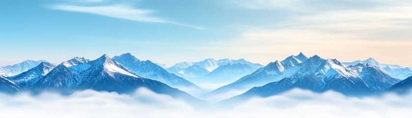Fototapeta premium Stunning mountain range under a clear blue sky with wispy clouds.