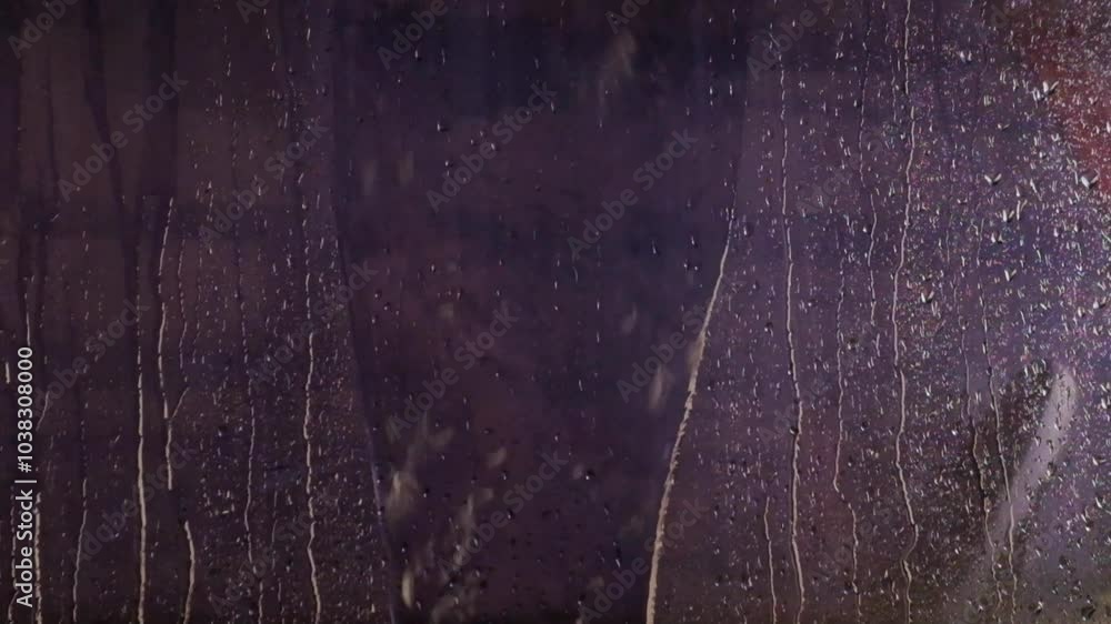 Aufkleber abstract shapes, patterns and textures of raindrops and droplets on black glass background.. it look