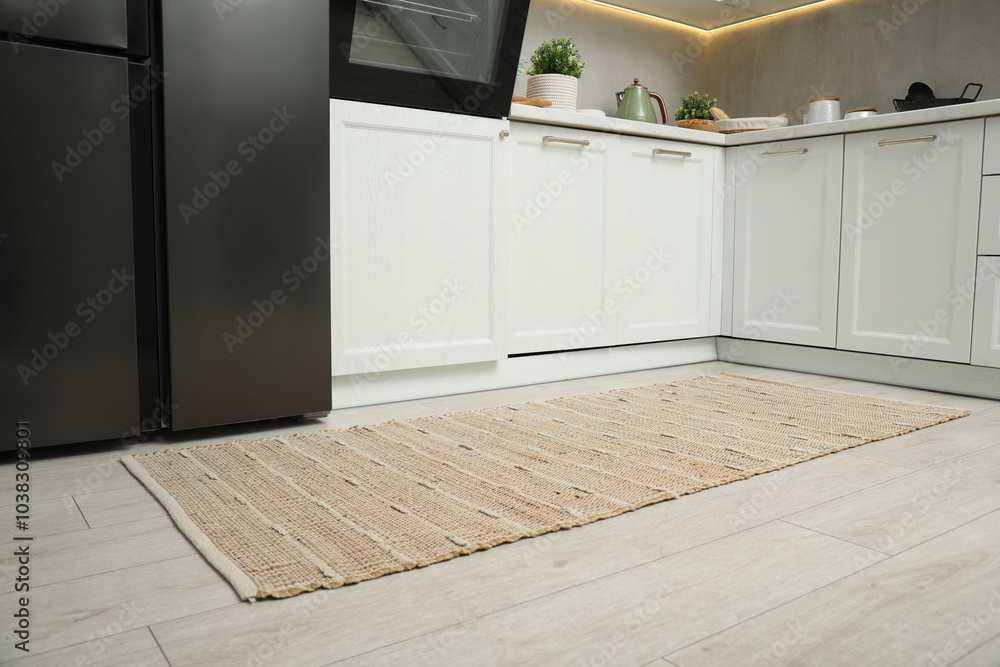 Canvas Prints Stylish soft rug on wooden floor in kitchen