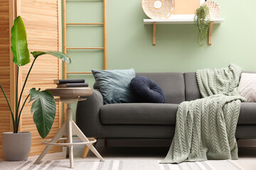 Living room with stool and sofa. Stylish interior design