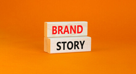 Brand story branding symbol. Concept words Brand story on beautiful wooden blocks. Beautiful orange background. Business brand story branding concept. Copy space.
