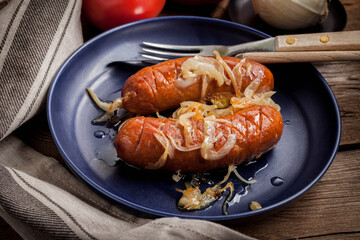 Fried sausage with onions.