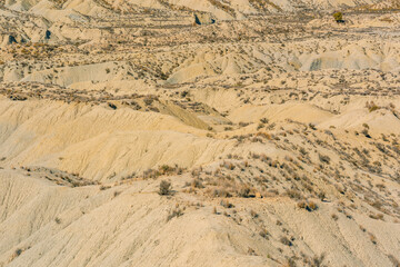 Arid mountainous desolate landscape on a sunny day.