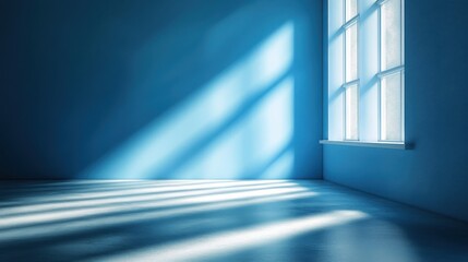 Soft beams of light illuminate a serene blue room with a smooth floor in gentle ambiance