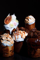 Easter cake on the festive table. Festive baked goods with exuberant spring colors on a dark...