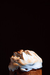 Easter cake on the festive table. Festive baked goods with exuberant spring colors on a dark background. 