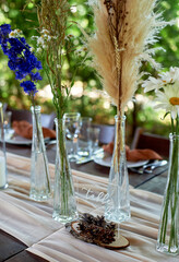 Wedding decoration. Floristics. Vessels with candles and bulk wax. Transparency and ease of design....