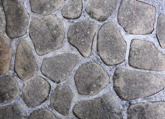 background of building wall made of decorative stones