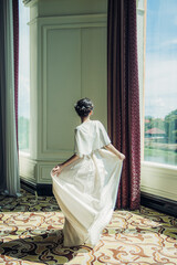 A moment of grace, elegance, and poise, bathed in the soft glow of natural sunlight.