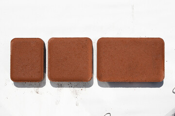 Paving slabs isolated on a white background. Concrete tile for laying tracks. Cement products. Construction works. Garden paths.