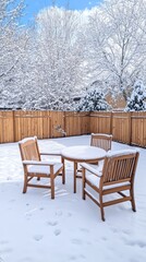Obraz premium Wooden patio furniture covered in snow in a serene winter yard setting.