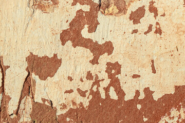 A fragment of a wall with red tints and yellow tint in the style of the 90s. Severe scratches and surface damage.