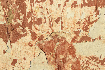 A fragment of a wall with red tints and yellow tint in the style of the 90s. Severe scratches and surface damage.