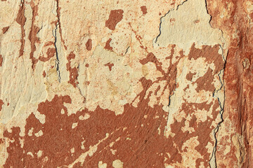 A fragment of a wall with red tints and yellow tint in the style of the 90s. Severe scratches and surface damage.