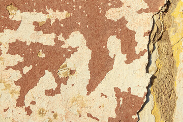 A fragment of a wall with red tints and yellow tint in the style of the 90s. Severe scratches and surface damage.