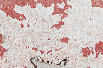 Grunge red concrete background. Textured plaster wall. Color of the year 2025 concept. Top view, layout for design. Surface with peeling shabby pattern.