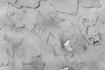 Grey concrete wall with natural defects. Fragment of the cement surface with natural texture. Universal background for conceptual advertising. Textured background for integration into the design.
