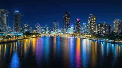 Fototapeta premium Vibrant City Skyline at Night View Over Water