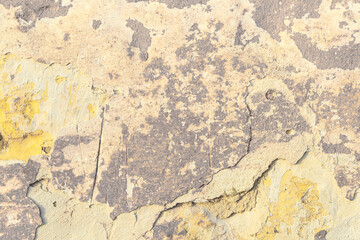 Grunge yellow concrete background. Textured plaster wall. Color of the year 2025 concept. Top view,...