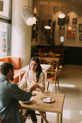 A delightful brunch experience at a cozy cafe featuring delicious dishes and refreshing beverages shared between two friends